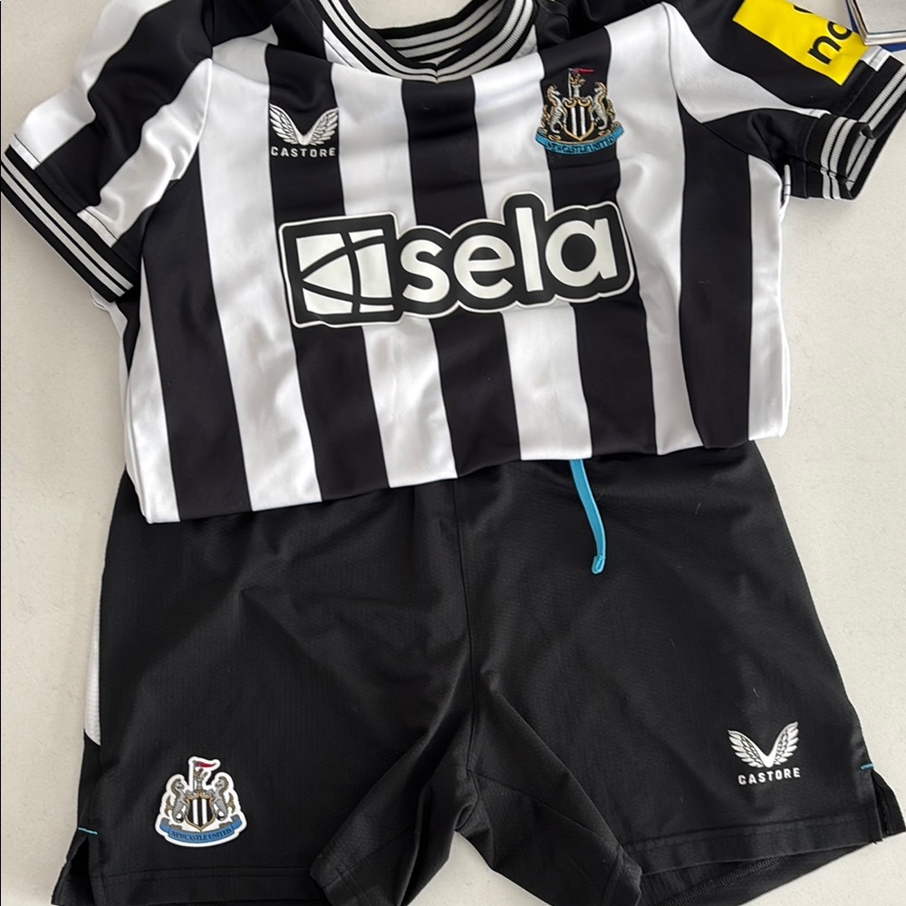 Updated!! Newcastle United soccer jersey and shorts and Jacket!!